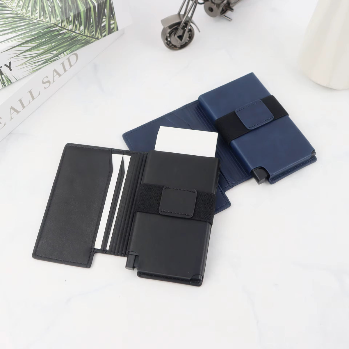 Two Riva Folio Wallets open side by side