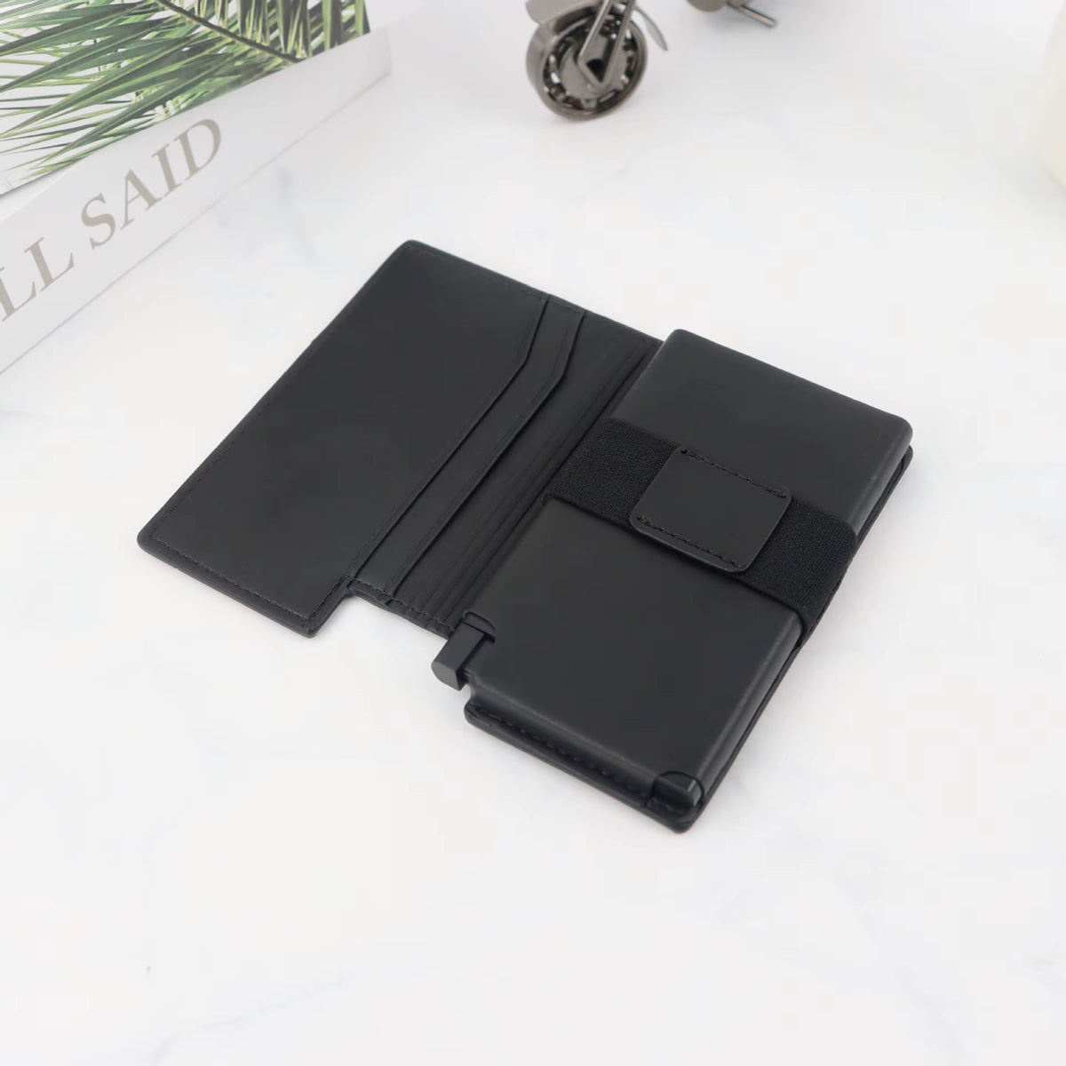 Riva Folio Wallet open showing the card sleeve and elastic cash strap