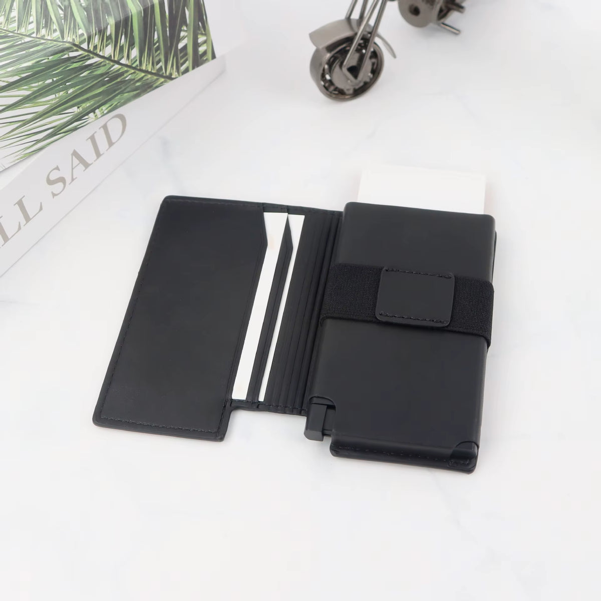 Riva Folio Wallet open with cards in the sleeve and pop-up case