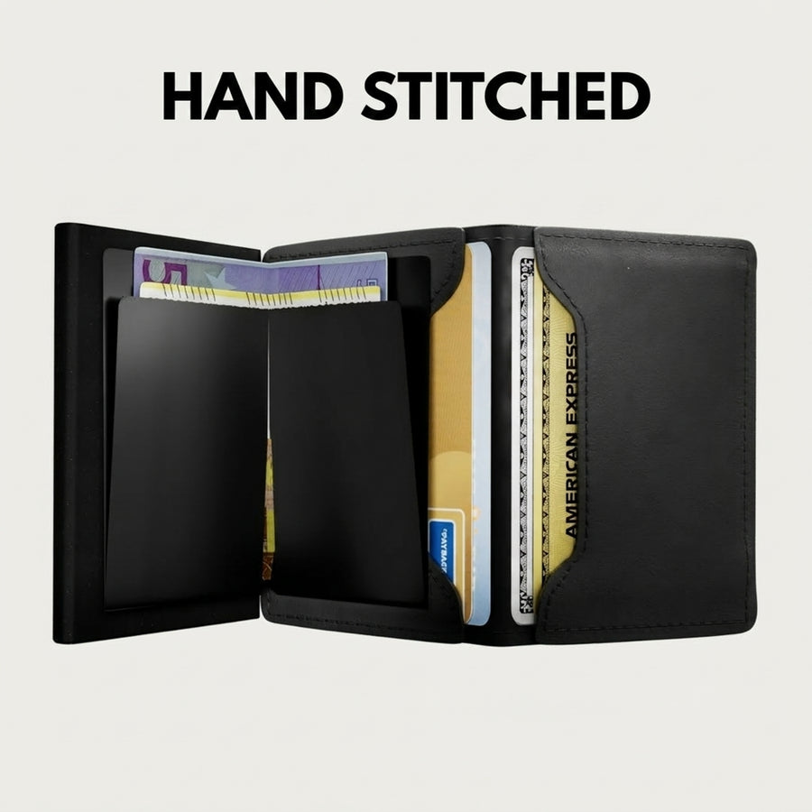 Hand stitched black leather Riva wallet fully open, showing card slots, cards and cash
